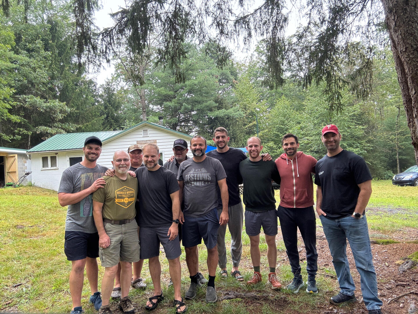 A smiling group of men for the 2025 Dudes & Dads retreat.